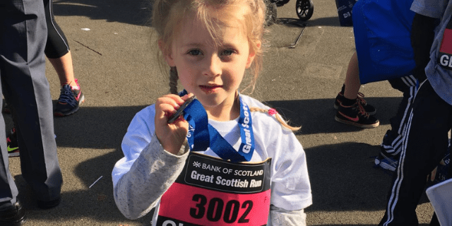 Girl with Great Scottish Run medal