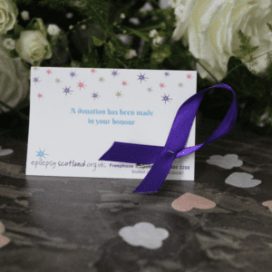 Favour with purple ribbon
