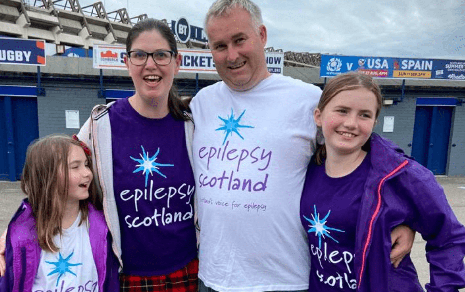 A man, woman and two children taking part in the Edinburgh Kiltwalk